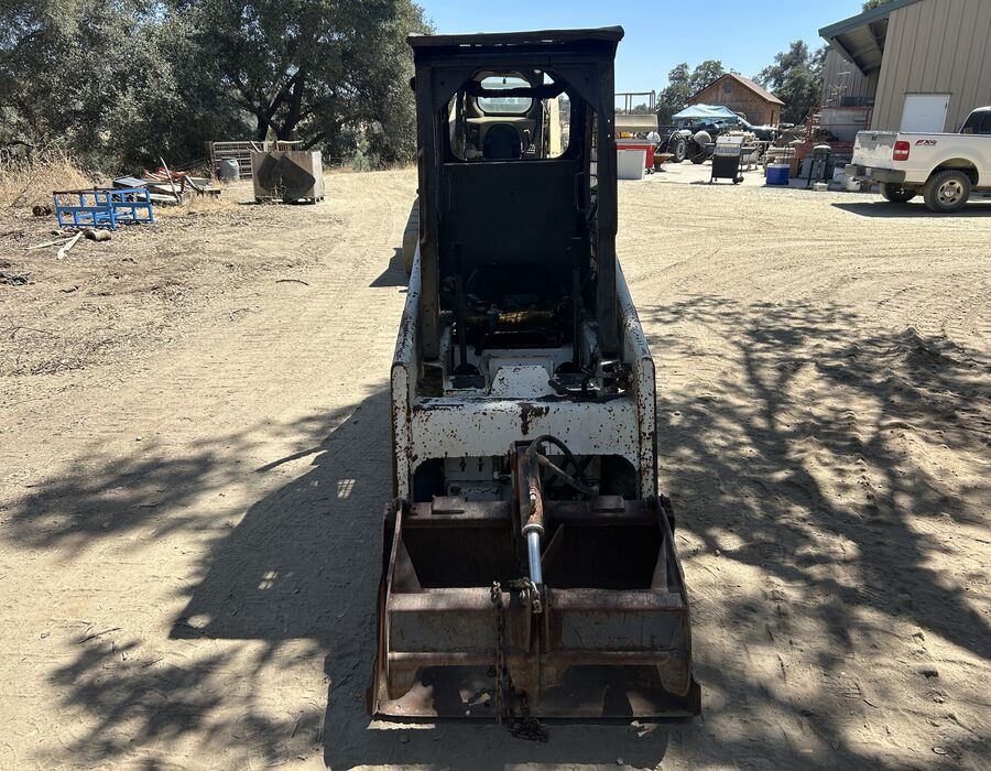 Mini Bobcat with grapple bucket