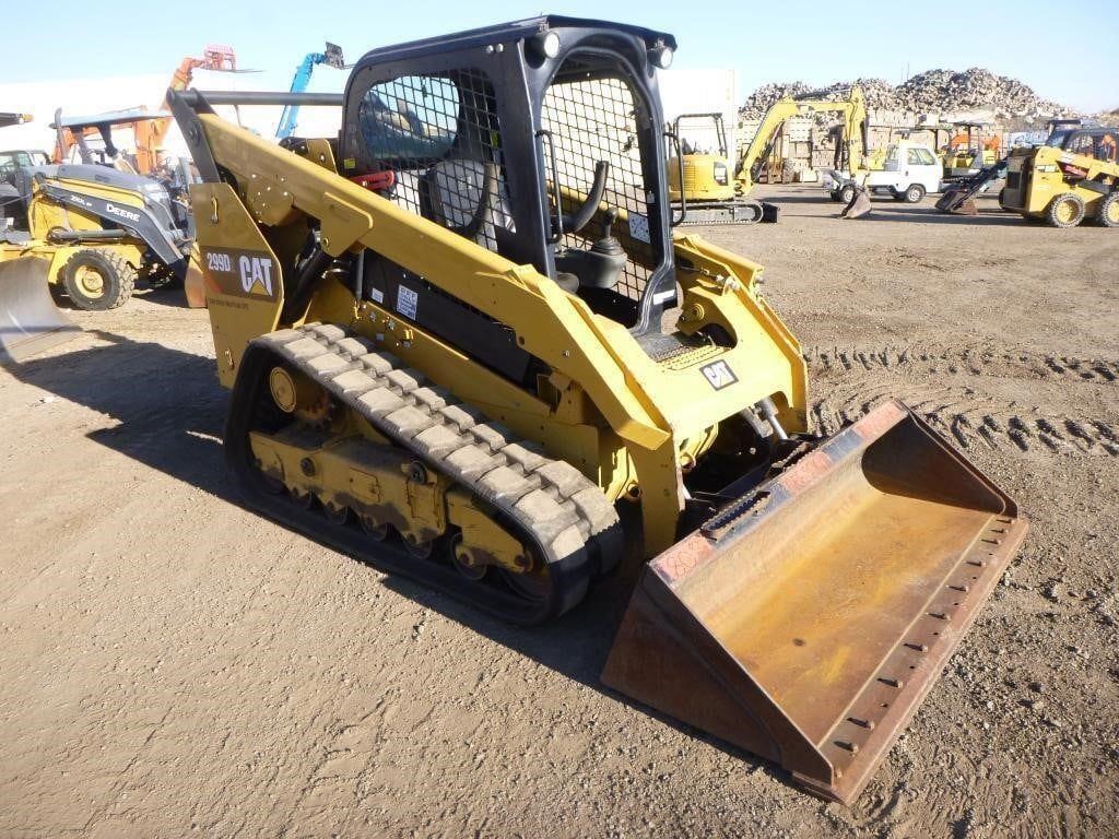 Yellow tracked skid steer with bucket